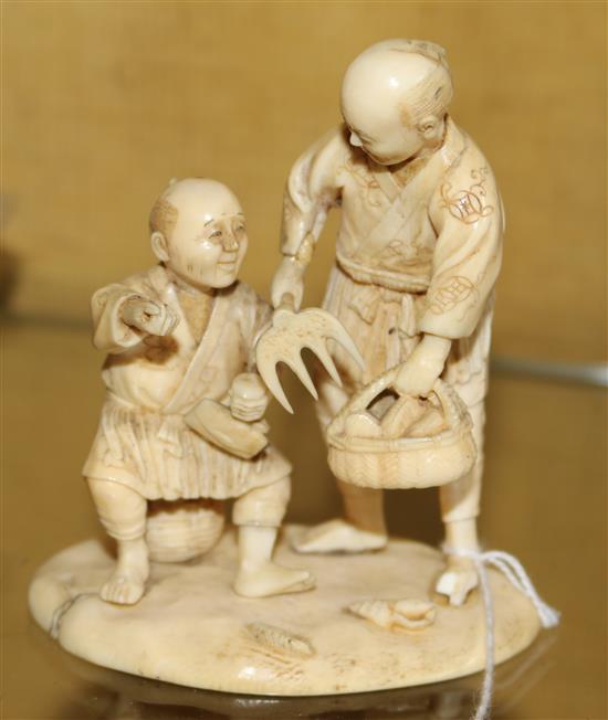 Japanese ivory group of two farmers